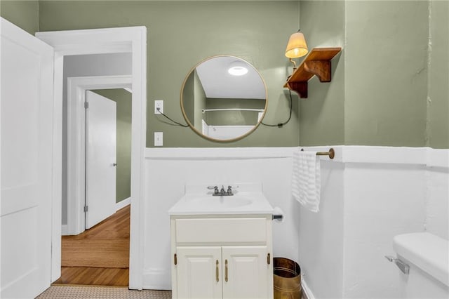 bathroom featuring tile patterned floors, vanity, and toilet