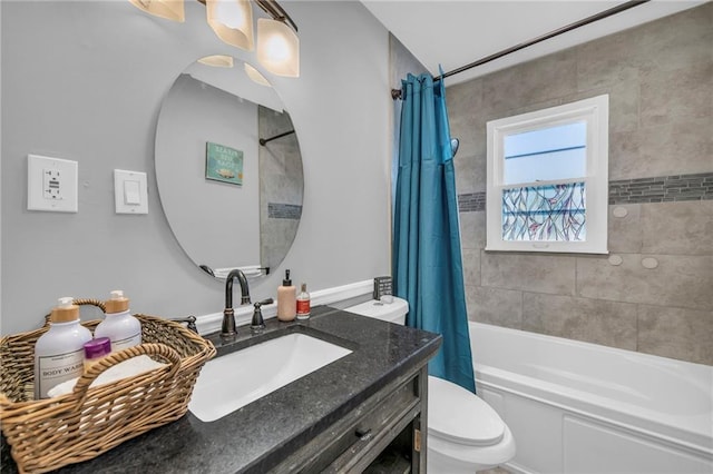 full bathroom with toilet, vanity, and shower / tub combo with curtain