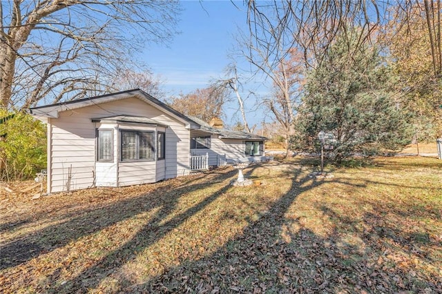 view of home's exterior featuring a yard