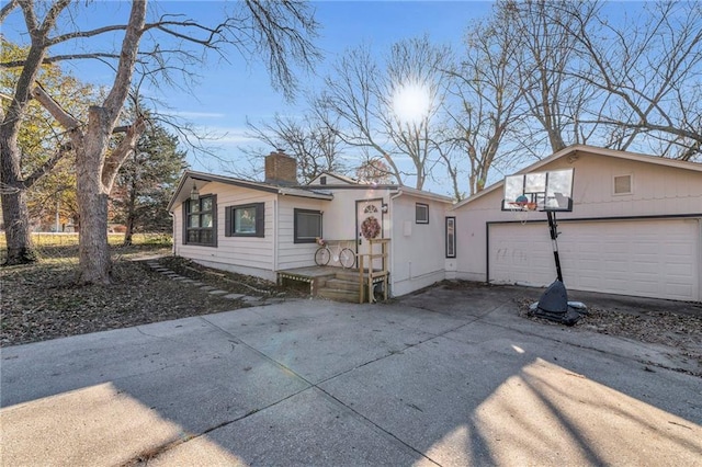 back of house featuring a garage