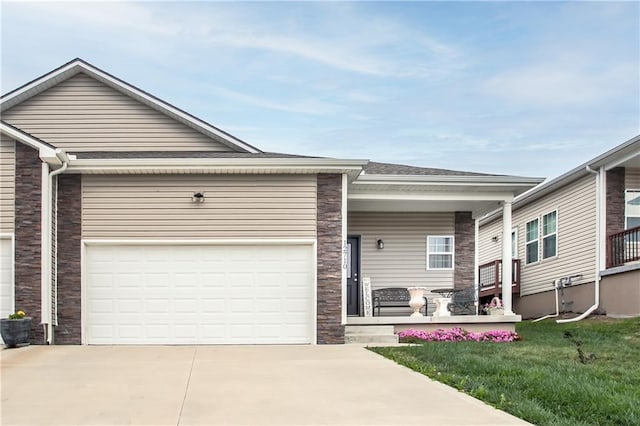 single story home featuring a garage and a front yard