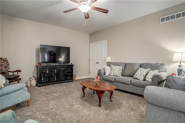 living room featuring carpet floors and ceiling fan