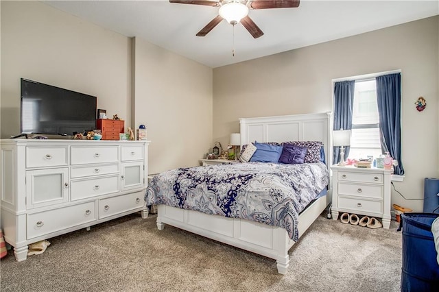 bedroom featuring ceiling fan and light carpet