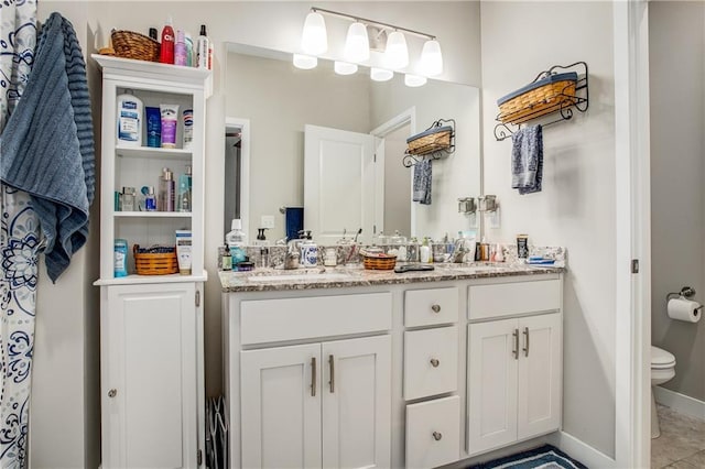 bathroom featuring vanity and toilet