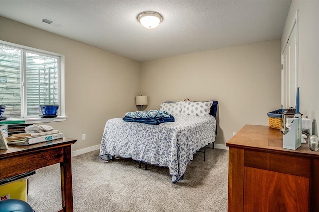 bedroom featuring light colored carpet