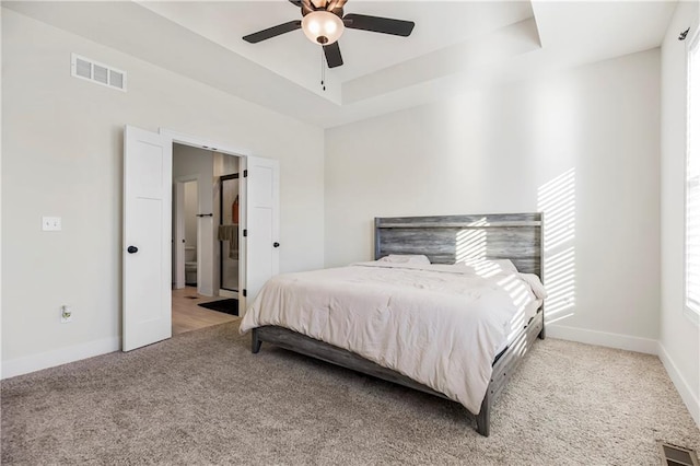 20915 W 190th Ter, Spring Hill, KS 66083 - carpeted bedroom featuring baseboards, a tray ceiling, and ceiling fan