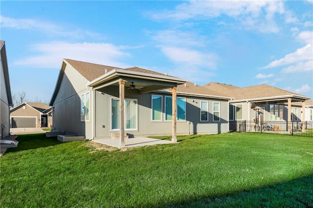 back of house with a yard, ceiling fan, and a patio area