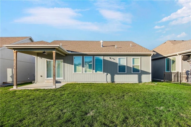 back of house with a lawn, ceiling fan, and a patio area