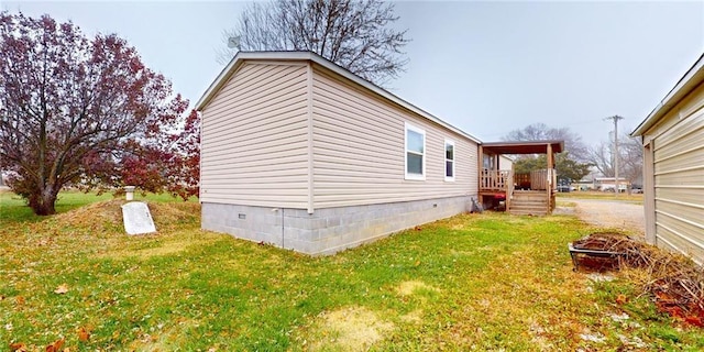 view of property exterior featuring a fire pit and a yard