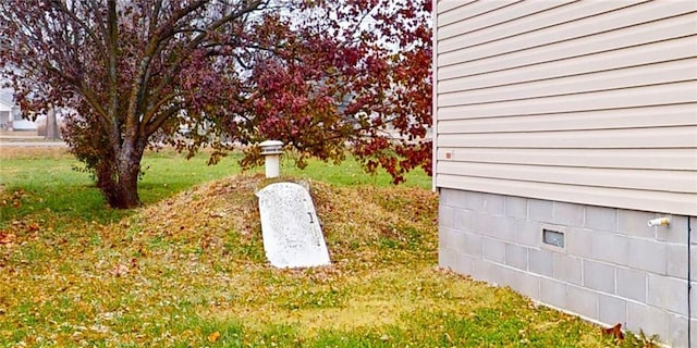 view of storm shelter featuring a yard