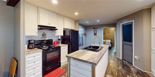 kitchen featuring sink, dark wood-type flooring, an island with sink, white cabinets, and black appliances