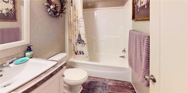 full bathroom with hardwood / wood-style floors, vanity, toilet, and shower / bath combo