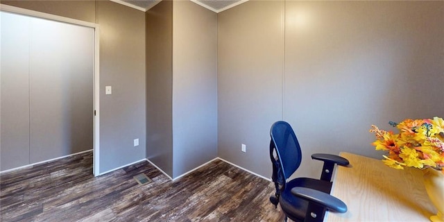 home office with dark hardwood / wood-style floors and crown molding