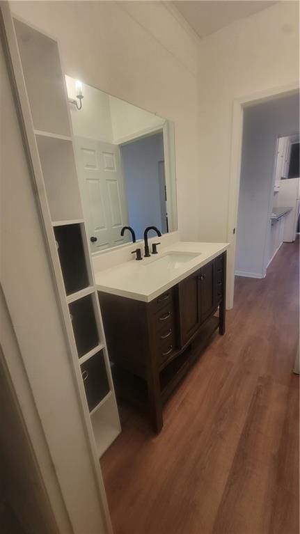 bathroom with vanity and hardwood / wood-style flooring