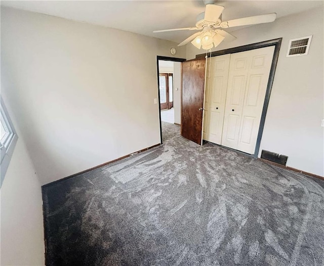 unfurnished bedroom featuring ceiling fan, carpet floors, and a closet