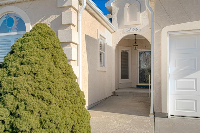 property entrance with a garage