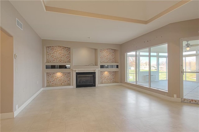 unfurnished living room featuring ceiling fan