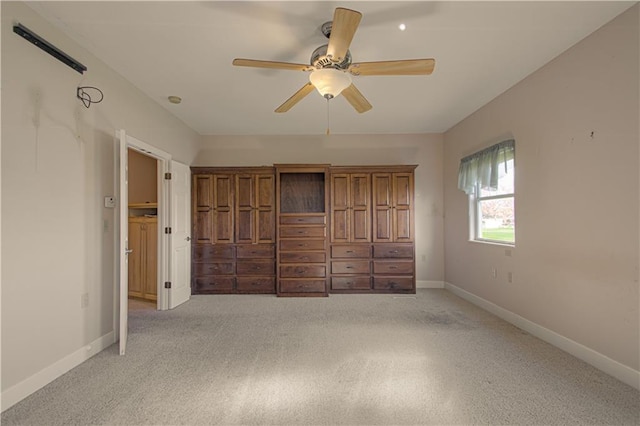 unfurnished bedroom with ceiling fan and light carpet