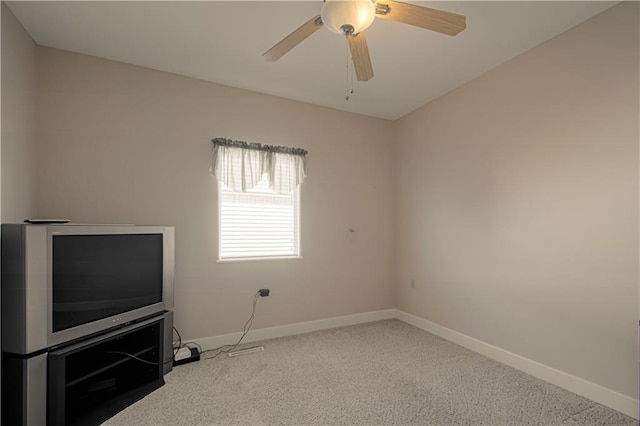 spare room with ceiling fan and carpet floors