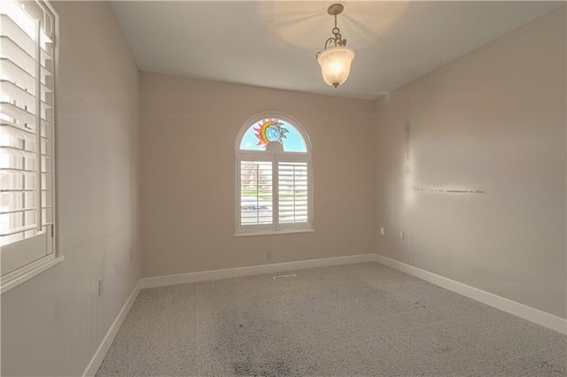 view of carpeted spare room