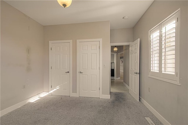 unfurnished bedroom featuring carpet floors