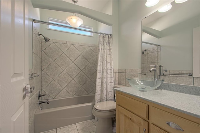 full bathroom with tile patterned flooring, shower / bath combo, toilet, and vanity