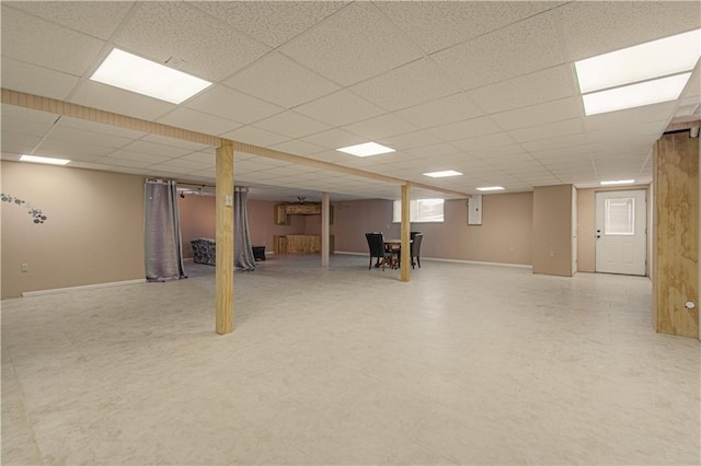 basement featuring a drop ceiling