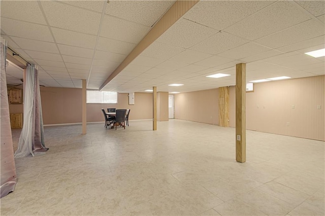 basement featuring a drop ceiling