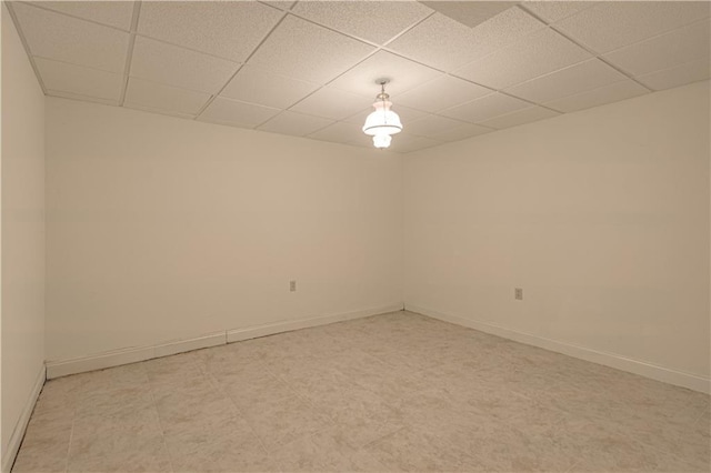 unfurnished room with a paneled ceiling