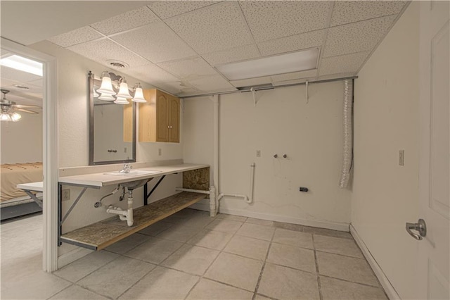 bathroom with a drop ceiling, tile patterned floors, and ceiling fan