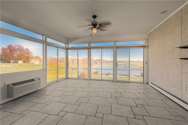 unfurnished sunroom featuring a wall mounted air conditioner, a water view, a baseboard radiator, and ceiling fan