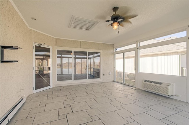 unfurnished sunroom with a baseboard radiator, a wall unit AC, and ceiling fan