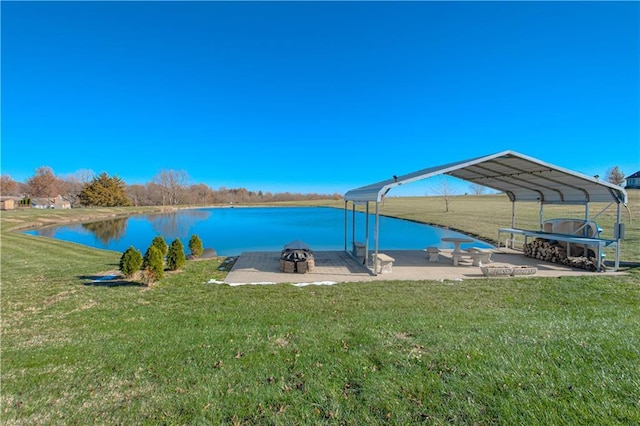 view of dock with a water view and a yard