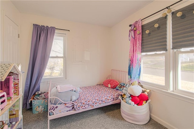 carpeted bedroom featuring radiator