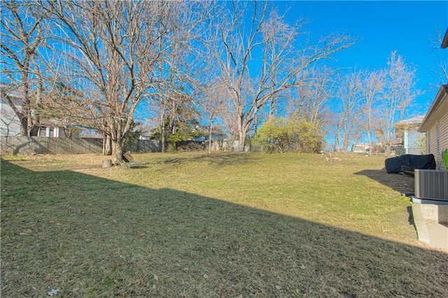 view of yard featuring central air condition unit