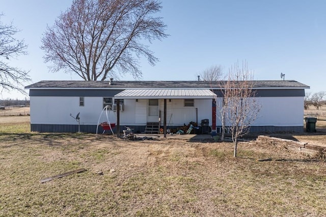 back of house with a yard