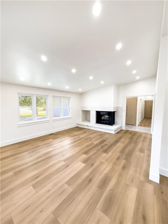 unfurnished living room with light hardwood / wood-style flooring