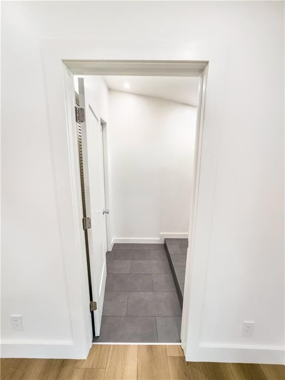 corridor featuring hardwood / wood-style floors
