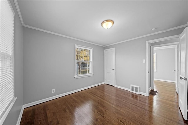 unfurnished room with dark hardwood / wood-style floors and ornamental molding