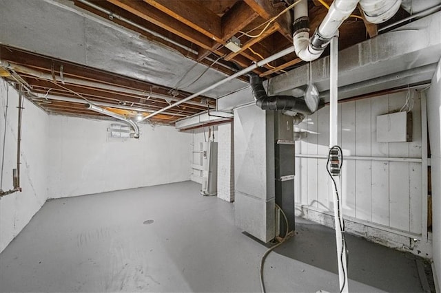 basement with heating unit and water heater