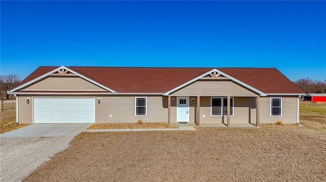 single story home featuring a porch and a garage