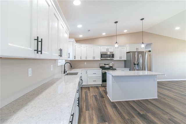 kitchen featuring white cabinets, sink, stainless steel appliances, and vaulted ceiling