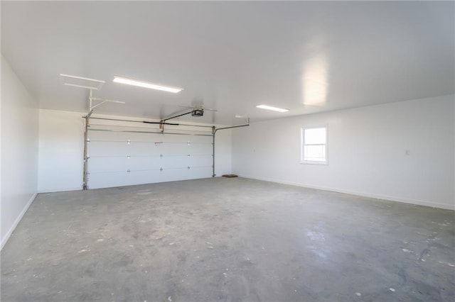 815 SW 520th Rd, Holden, MO 64040 - garage featuring a garage door opener and baseboards
