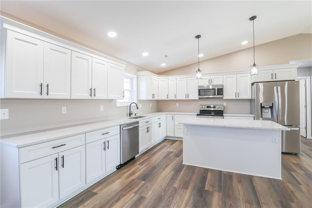 815 SW 520th Rd, Holden, MO 64040 - kitchen with appliances with stainless steel finishes, vaulted ceiling, white cabinets, dark wood finished floors, and recessed lighting