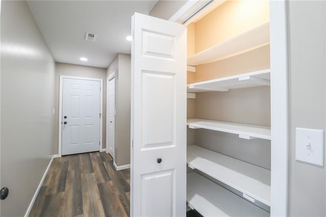 interior space with dark hardwood / wood-style floors