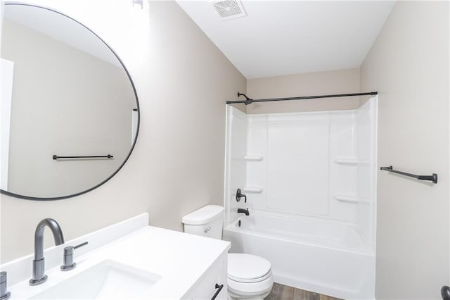 full bathroom with toilet, vanity, tub / shower combination, and hardwood / wood-style flooring