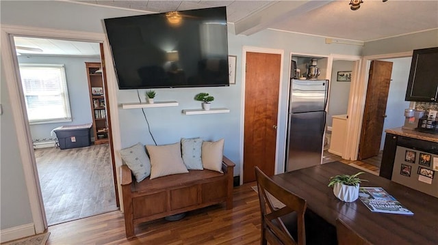 living room with hardwood / wood-style flooring and beamed ceiling