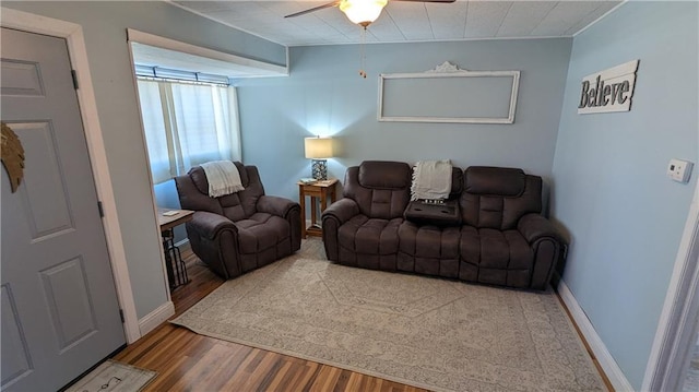 living room with hardwood / wood-style flooring and ceiling fan