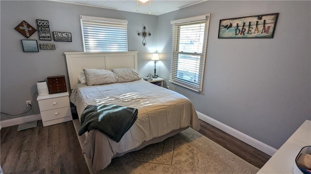 bedroom featuring dark wood-type flooring and ornamental molding