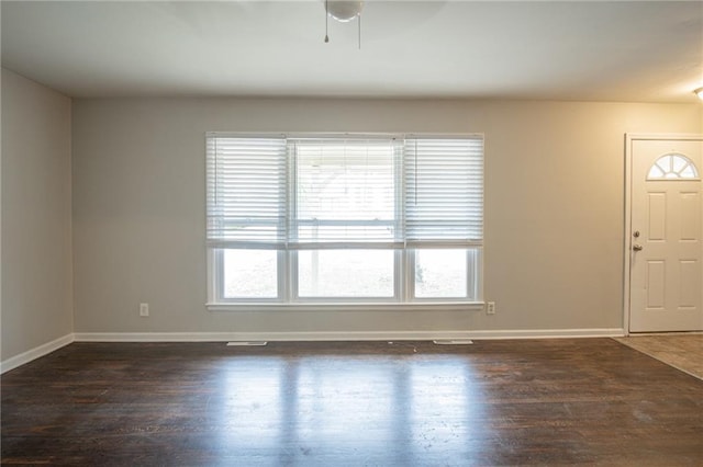 entrance foyer featuring ceiling fan and dark wood-type flooring